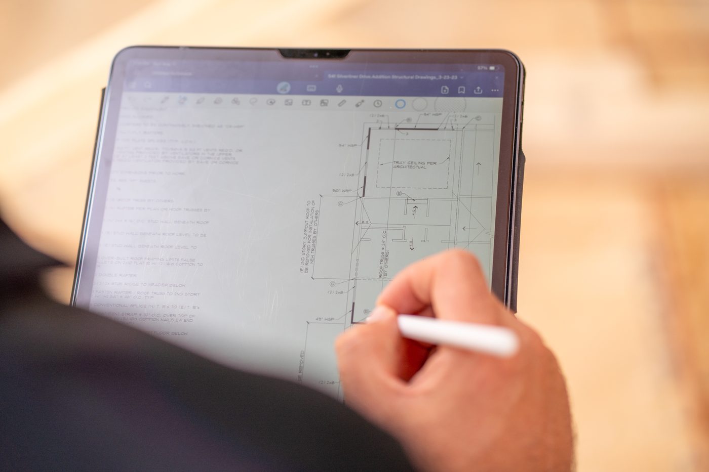 Marking up structural plans on a tablet at the job site
