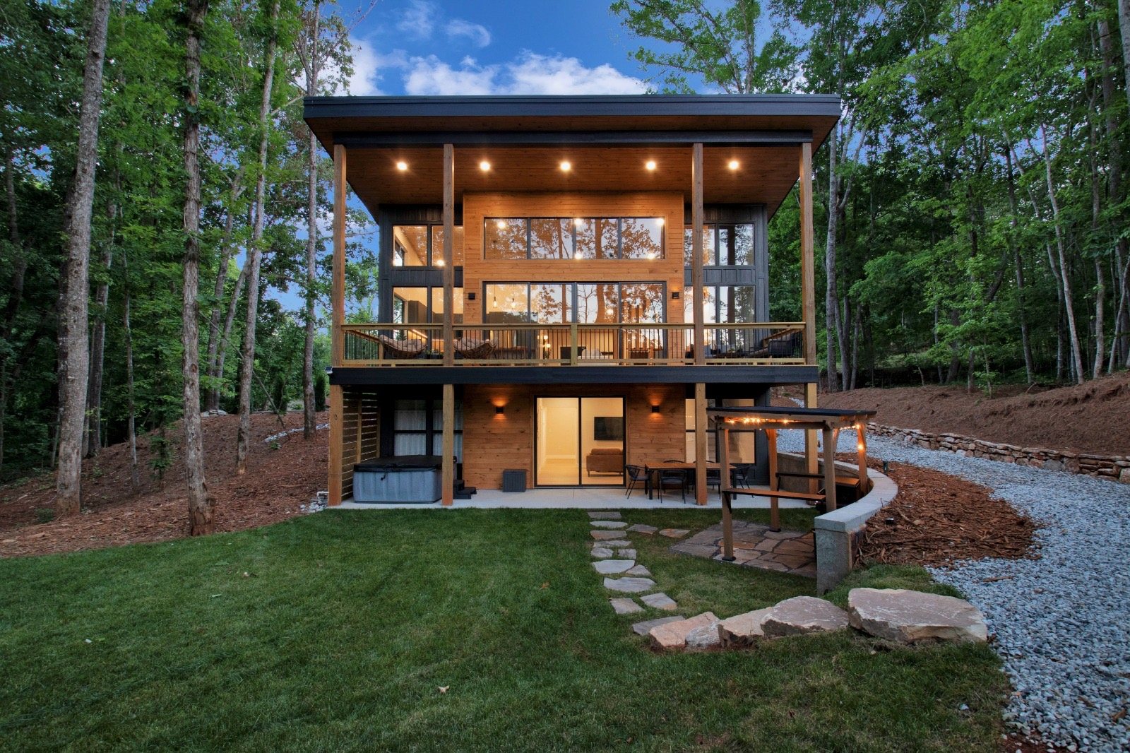 Completed modern two-story custom home in the woods, engineered by Oakline for a client